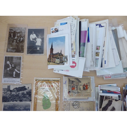 106 - Uncollated early 20thC ephemera; postcards; and used postage stamps on letters