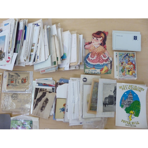 106 - Uncollated early 20thC ephemera; postcards; and used postage stamps on letters