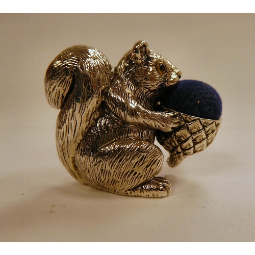 125 - A Victorian style silver coloured metal novelty pin cushion, featuring a squirrel  stamped 925