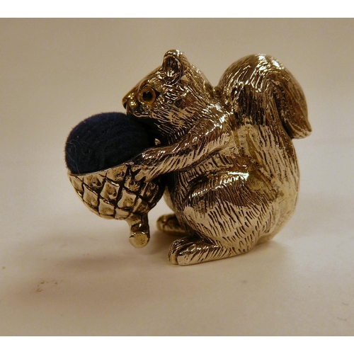 125 - A Victorian style silver coloured metal novelty pin cushion, featuring a squirrel  stamped 925