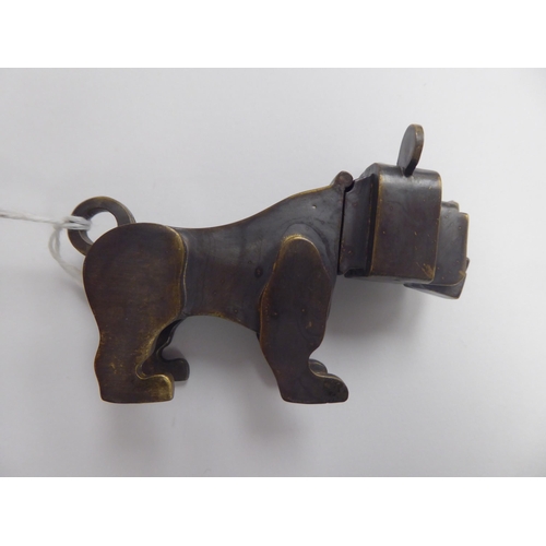 129 - A bronze boxer dog's head vesta case, incorporating a strike plate