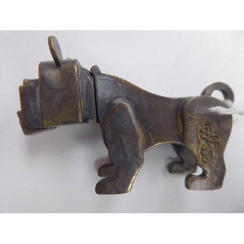 129 - A bronze boxer dog's head vesta case, incorporating a strike plate