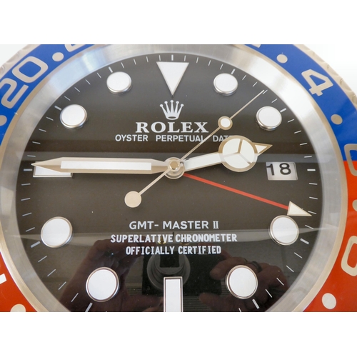 130 - A dealer display advertising wall timepiece for Rolex Oyster Perpetual; the movement faced by a bato... 