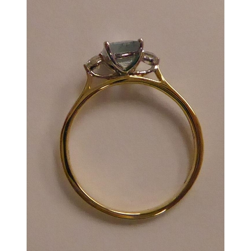 131 - An 18ct gold claw set, aquamarine and diamond set ring