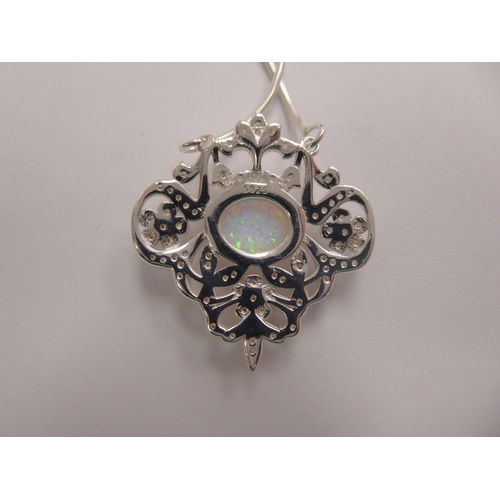 137 - A silver coloured metal opal and cubic zirconia set necklet, on a fine neckchain  stamped 925