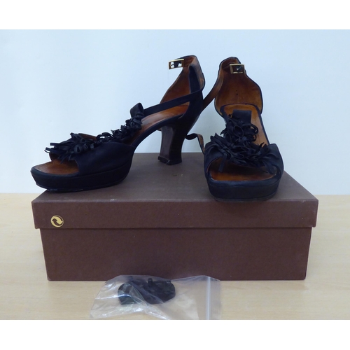 156 - A pair of lady's Chie Mihara black sandals  size 41  boxed