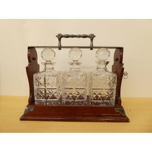 182 - A modern mahogany and silver plated tantalus with three cut glass decanters  13