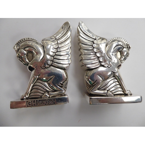 184 - A pair of Pegasus inspired white metal condiments pots  stamped 800