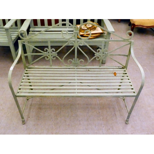 201 - A green painted cast and wrought metal framed garden bench, on straight legs  46