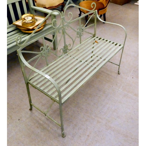 201 - A green painted cast and wrought metal framed garden bench, on straight legs  46