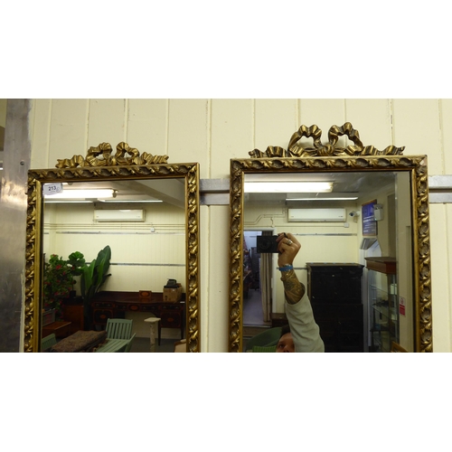 213 - A pair of mid 20thC mirrors, the plates set in moulded gilt frames  50