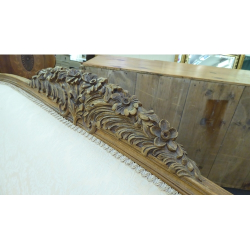 223 - A 20thC French style stained and foliate carved, beech showwood framed carved back salon settee, uph... 