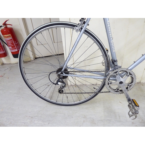 23 - A Geoffrey Butler 12 gear racing/road bicycle with 700c wheels