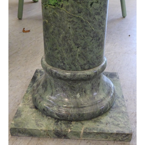 233 - A green marble pedestal  39