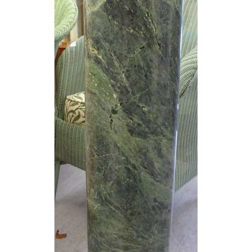 233 - A green marble pedestal  39