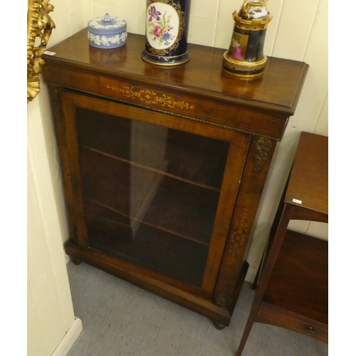 234 - A late Victorian string inlaid mahogany pier glass, the glazed door enclosing two shelves, on a plin... 