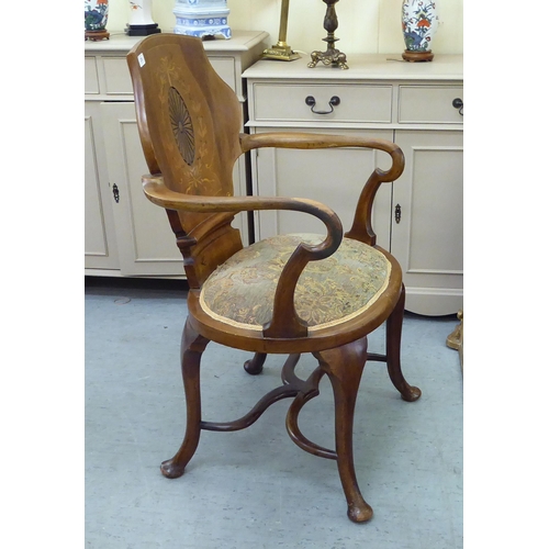 236 - An Edwardian Art Nouveau design, string inlaid, walnut framed, panel back, open arm salon chair with... 