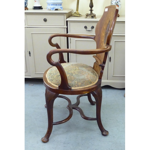 236 - An Edwardian Art Nouveau design, string inlaid, walnut framed, panel back, open arm salon chair with... 