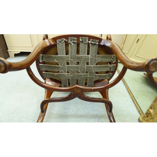 236 - An Edwardian Art Nouveau design, string inlaid, walnut framed, panel back, open arm salon chair with... 