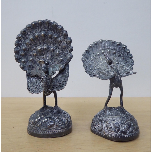 24 - Two white metal peacock ornaments  3