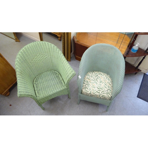 242 - Two Lloyd Loom style, green painted chairs