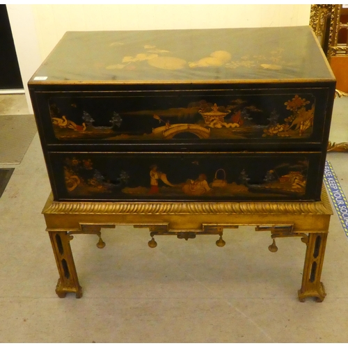 272 - An early 20thC Oriental black painted and gilt decorated, two drawer cabinet-on-stand  35