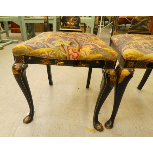 273 - Two early/mid 20thC Oriental black painted and gilt decorated splat back hall chairs, raised on cabr... 