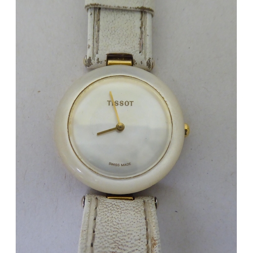 292 - A lady's Tissot Rockwatch with a mother-of-pearl face, on a white hide strap