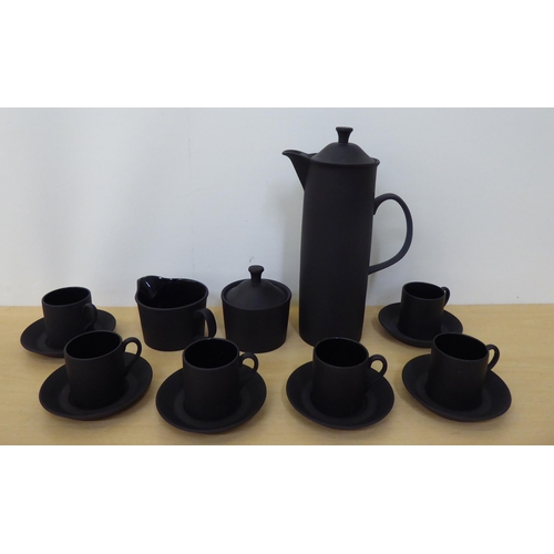 307 - A Wedgwood black basalt coffee set, comprising six cans and saucers, coffee pot, sugar pot and cream... 