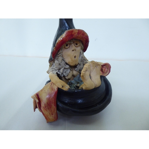 310 - A Halloween themed pottery model, a naked witch, taking a bath in a cauldron  8