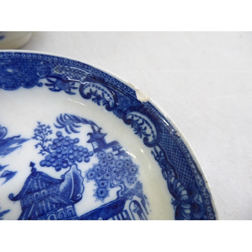 35 - Two 19thC porcelain tea bowls and saucers, decorated in blue and white Oriental taste