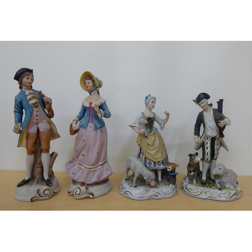 39 - Late 19th/mid 20thC, mainly Continental, porcelain/china figures, a vase and a group with a man and ... 