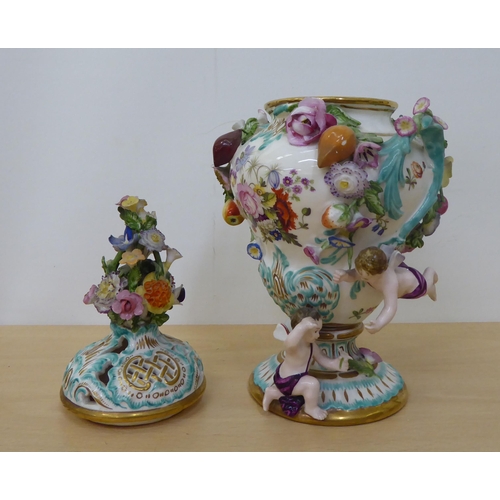 39 - Late 19th/mid 20thC, mainly Continental, porcelain/china figures, a vase and a group with a man and ... 