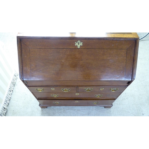 48 - A 19thC and later crossbanded mahogany and walnut bureau, the fall-flap over two short/two long draw... 