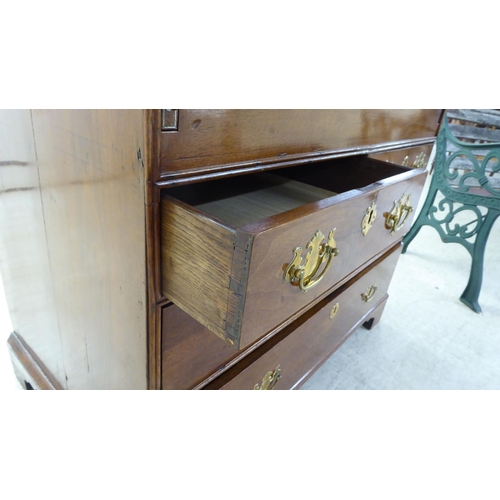 48 - A 19thC and later crossbanded mahogany and walnut bureau, the fall-flap over two short/two long draw... 