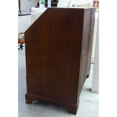 48 - A 19thC and later crossbanded mahogany and walnut bureau, the fall-flap over two short/two long draw... 