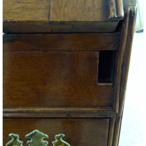 48 - A 19thC and later crossbanded mahogany and walnut bureau, the fall-flap over two short/two long draw... 