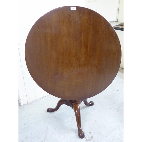 54 - A 20thC Georgian style polished mahogany tip-top pedestal table, over a birdcage, turned column and ... 