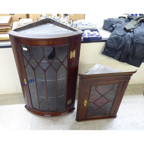 59 - Two dissimilar mahogany corner cabinets with glazed doors  39