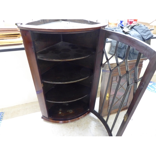 59 - Two dissimilar mahogany corner cabinets with glazed doors  39