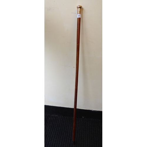 67 - A 9ct gold capped Malacca walking cane