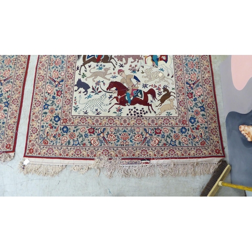 94 - A pair of Persian part woven silk pictorial rugs, depicting figures on horseback, on a hunt  59... 