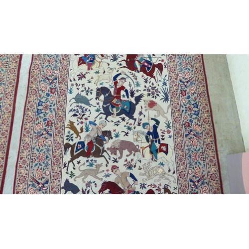 94 - A pair of Persian part woven silk pictorial rugs, depicting figures on horseback, on a hunt  59... 