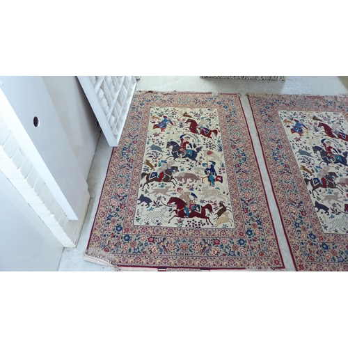 94 - A pair of Persian part woven silk pictorial rugs, depicting figures on horseback, on a hunt  59... 