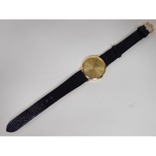 104 - A Rolex Cellini 18ct gold cased wristwatch, faced by a baton dial, on a brown hide strap