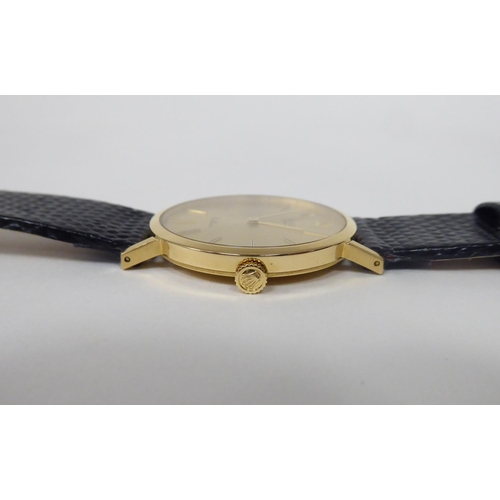 104 - A Rolex Cellini 18ct gold cased wristwatch, faced by a baton dial, on a brown hide strap