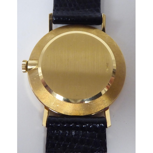 104 - A Rolex Cellini 18ct gold cased wristwatch, faced by a baton dial, on a brown hide strap