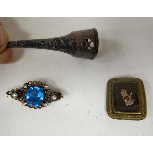 106 - A mixed lot: to include an amber and neilloworked cigarette holder; and a sweetheart brooch