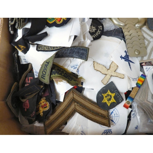 108 - A varied collection of mainly military uniform logos and flashes, some copies(Please Note: this lot ... 