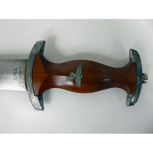 112 - A German student's dagger with a stained brown handgrip and applied swastika emblem, the 8.5